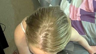 The blonde mommy with HUGE NATURAL TITS knelt to SUCK step son's BIG COCK and LICK his BALLS in the bedroom.