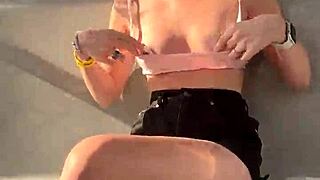 Watch this cute girl give a blowjob in public on a Ferris wheel