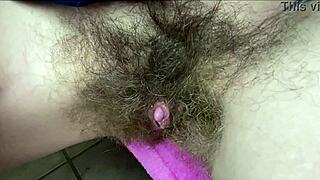 nasty hairy pussy with huge clit gets wet from vibrator close up