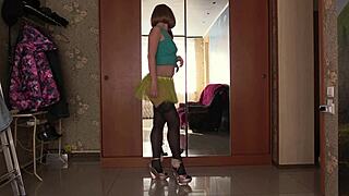 a gorgeous ass tries short skirts in mirror