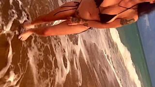 Huge tits ebony beauty urinates outdoors on a sunny beach