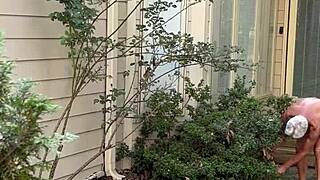Naked man gardens outdoors again