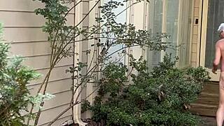Naked man gardens outdoors again