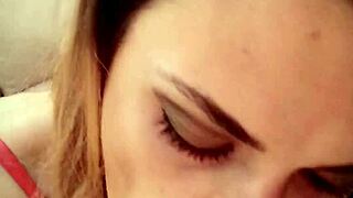 Young girl with red lipstick gives blowjob on redvideos