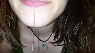 hot babe spits on cock in fetish scene