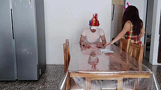 A maid fulfills a dark fetish in front of a man at home
