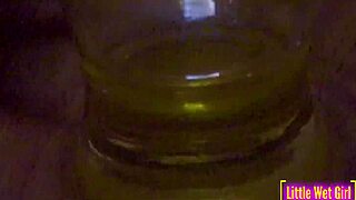 pissing inside a vase at the bar