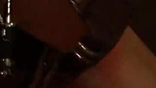 lesbian mistress orgasms from strapon while slave chained