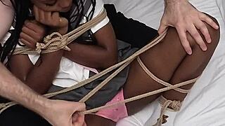 Tied up ebony schoolgirl made to cum hard