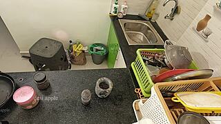 Girlfriend massaging with oil in kitchen