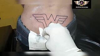 why is this transsexual getting a tattoo on her ass?