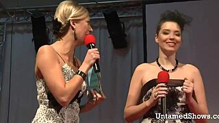 sexy blonde dances on stage with hot body, ripping clothes in striptease