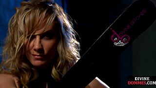 Curvy mistress whipping her captive in intense bondage session