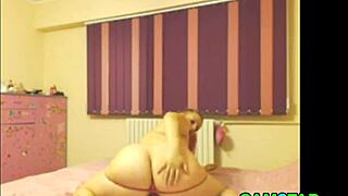 Webcam video showcasing large breasts in solo action.