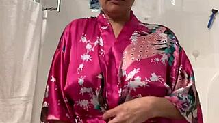 Anna dances teasingly in her robe