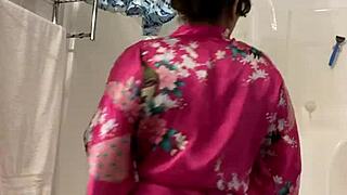 Anna dances teasingly in her robe