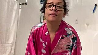 Anna dances teasingly in her robe