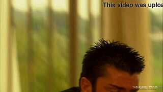 He expresses love to the brunette, then they have steamy sex on the balcony.