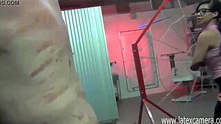 Asian mistress in glasses delivers painful whipping session
