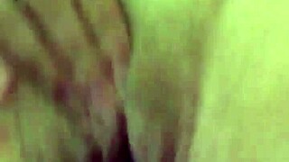 Teasing her dry pussy lips with a vibrator, contrasting sensations in intimate play.