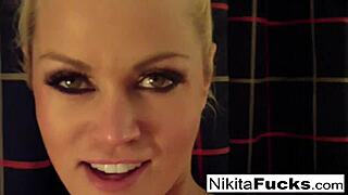 Solo fishnet tease with hot milf Nikita owning the scene