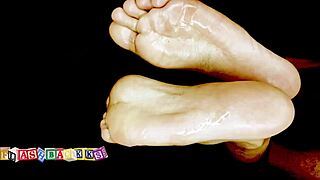 The masseuse gives a wet oily foot massage