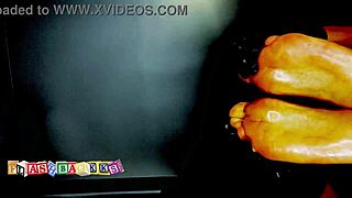 The masseuse gives a wet oily foot massage