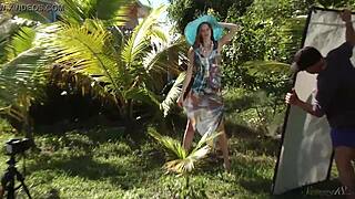 Charming young model undresses in outdoor setting