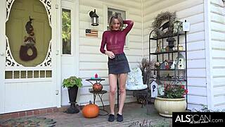 Petite babe teases camera with striptease and fingering outside