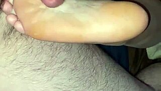 Two sexy women indulge in footjob and vagina sex