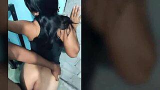 A Latino man and a brunette engage in passionate sex against a wall