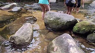 walking freely by the waterfall, enjoying the view