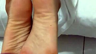I cum while smelling the prostitute's feet in this fetish scene.