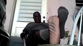 bear master shows his big feet needing a slave