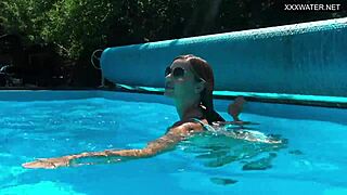 angelica relaxes by the swimming pool, looking her best