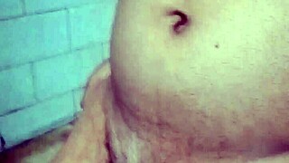 Indian gay bottom takes his own golden shower, pissing on himself in a solo act of self-pleasure