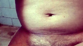 Indian gay bottom takes his own golden shower, pissing on himself in a solo act of self-pleasure