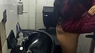 Latina student gets caught masturbating in the bathroom by the camera