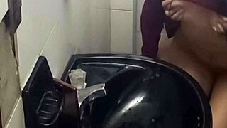Latina student gets caught masturbating in the bathroom by the camera
