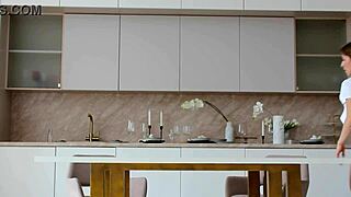 A young girl in lingerie poses enticingly in her white thong