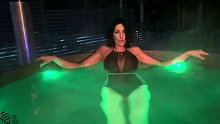 Is this perfect brunette's outdoor bath more than just relaxing with big tits?