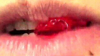 close up of fifi foxx's mouth vore eating gummy bears