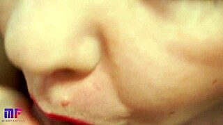 This babe performs a close-up scene with red lips