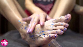 Babe delivers a sensual footjob on a rubber cock, indulging in foot fetish pleasures.