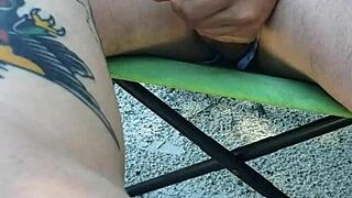 Public beach scene unfolds as guy jerks and squirts on her legs. A daring outdoor moment.