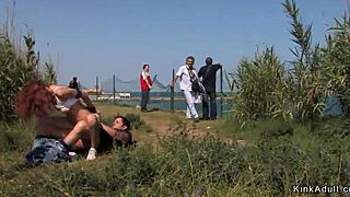 Redhead slave fucked at river view