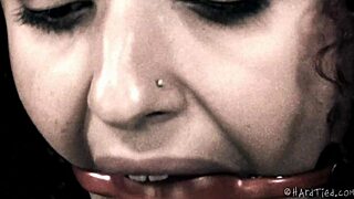 Mixed girl screams as bound in bdsm bondage with caning and fisting!