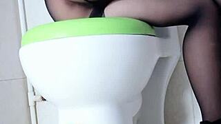 Asian woman secretly masturbates in toilet