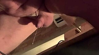 Fat white gay sissy squirts cum under machine pounding.