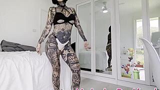 Melody Radford tries on pink micro bikini with chain